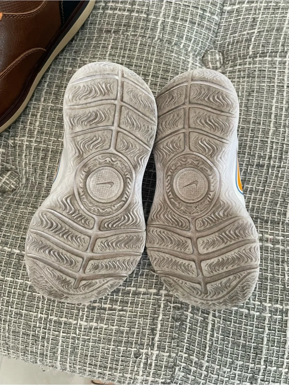 Nike Kids White Sneakers with Blue and Yellow Accents